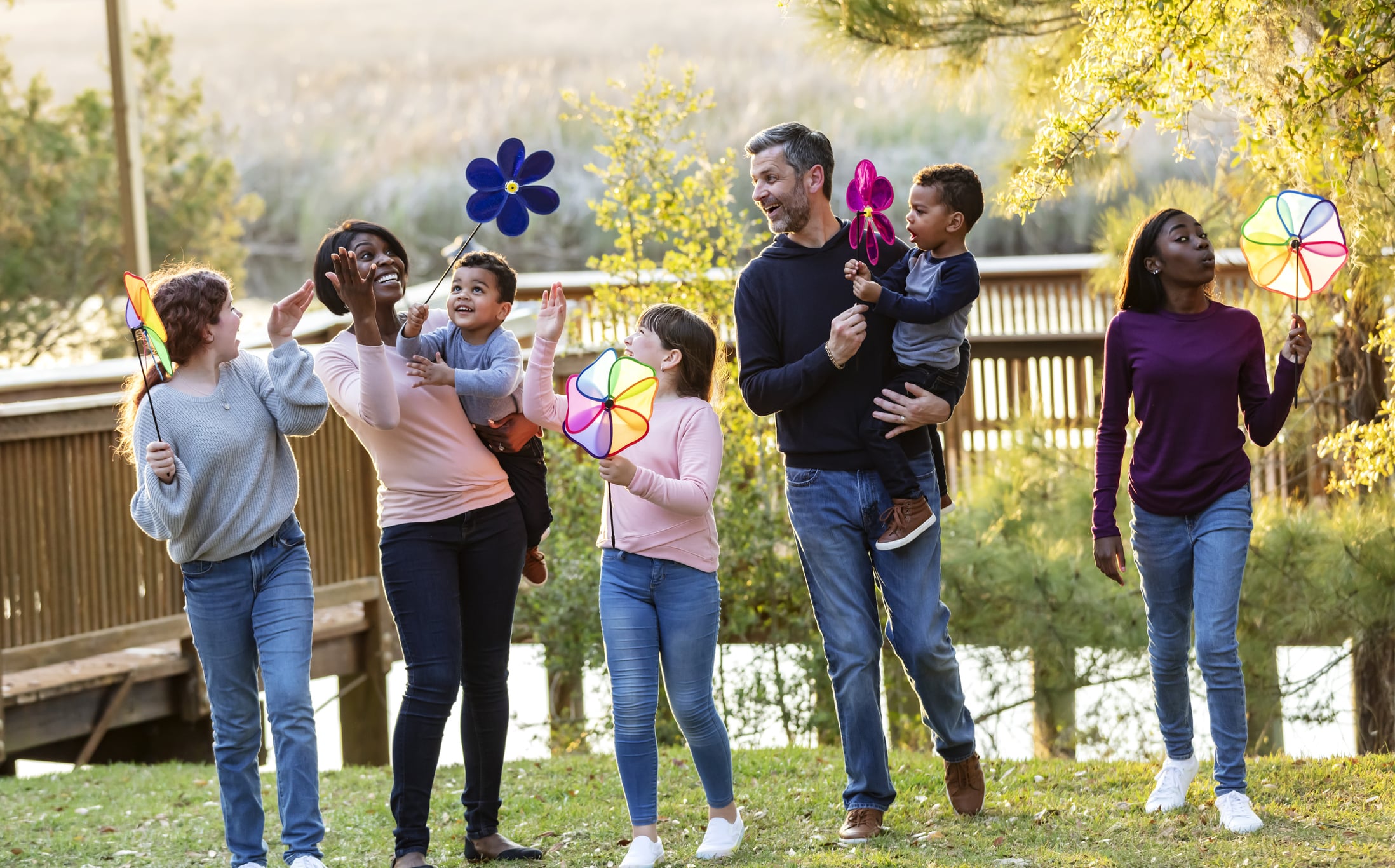 Blended family with five children playing at the park