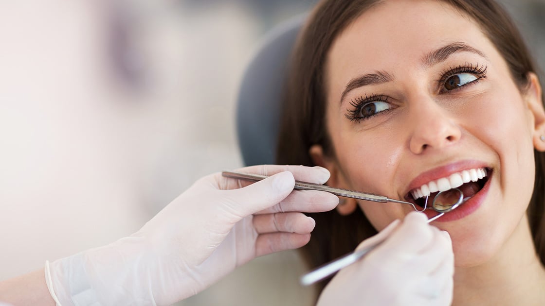 Woman with dental tools 